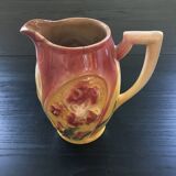 Old pitcher with pink iris decor