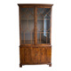 Classic English display cabinet in wood with glass doors.