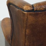 Sheep leather wing chair with patina