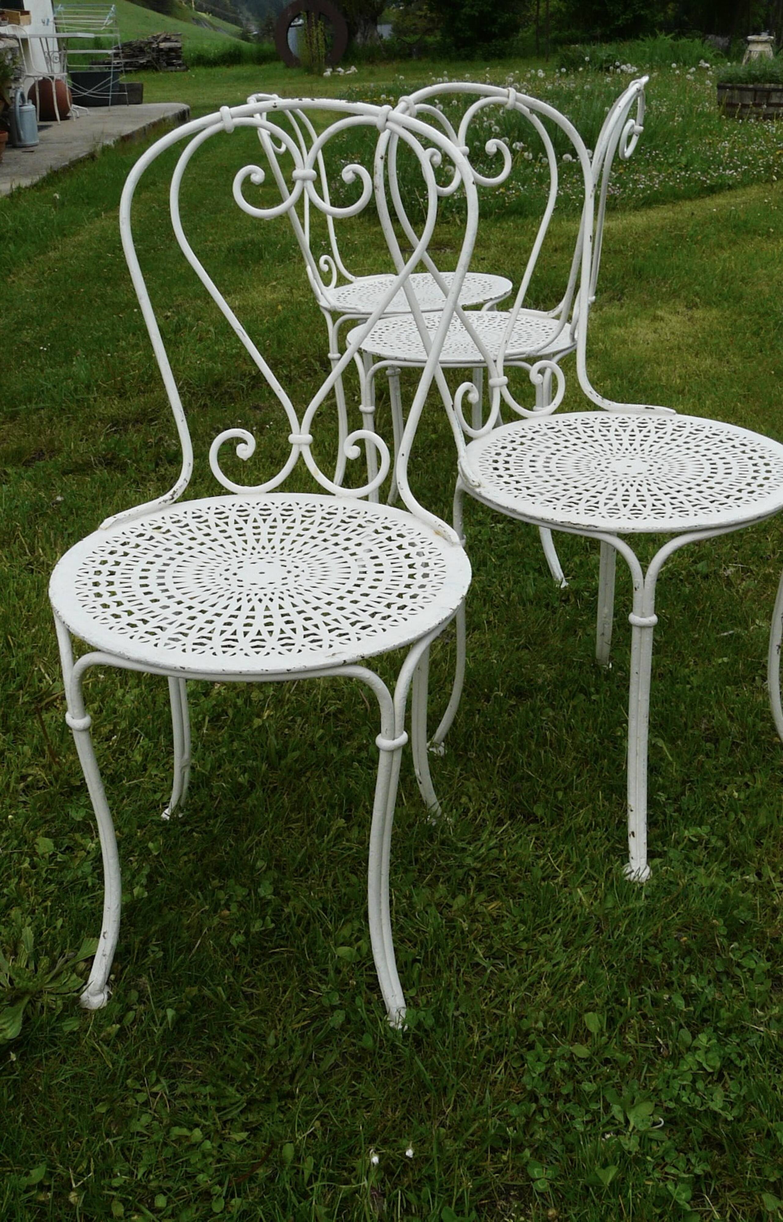 Set of 4 19th century wrought iron garden chairs with heart motif