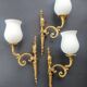 Three large vintage torch wall sconces.