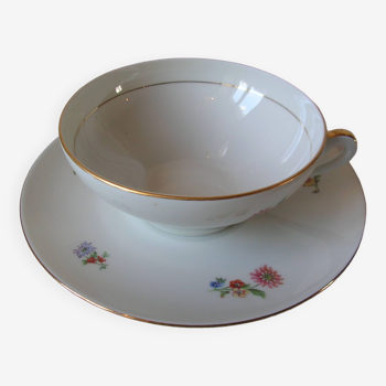 Old large tea cup and saucer in Limoges porcelain with flower decor