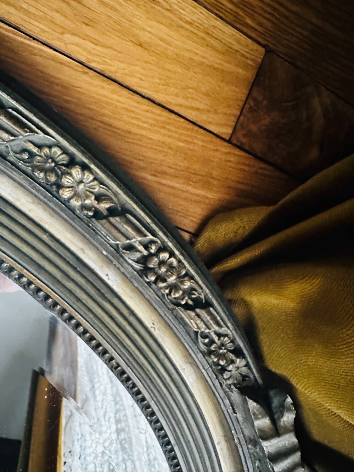 Large antique oval mirror