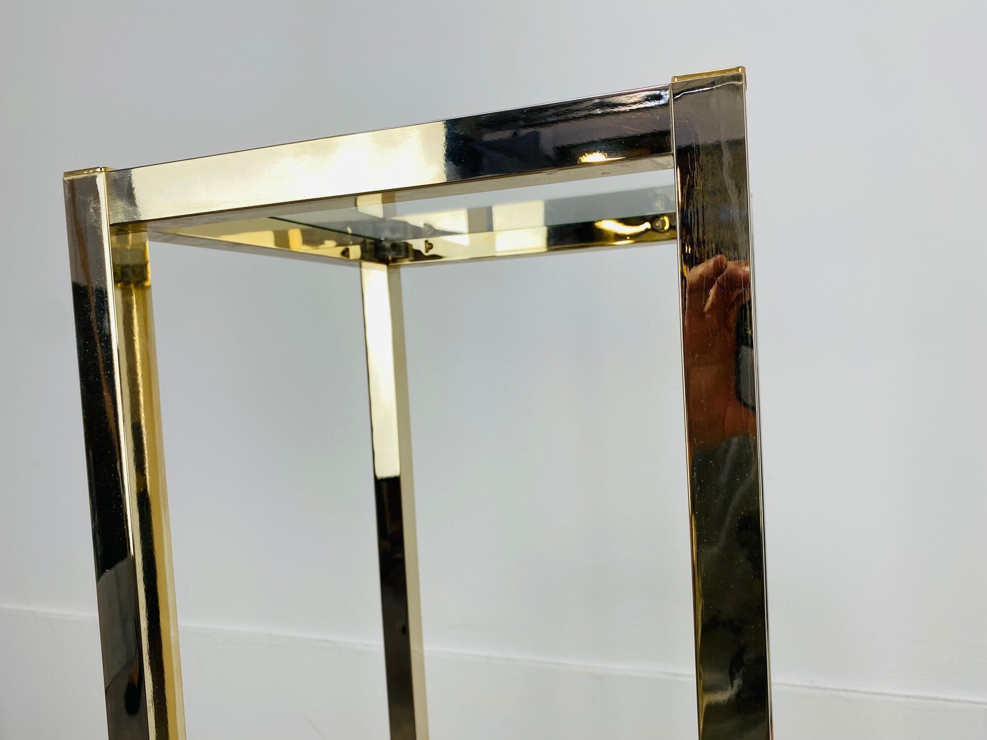 Gilded metal fifth wheel column and Hollywood Regency style glass 70s