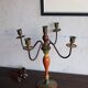 Old candlestick in painted wood and folding metal