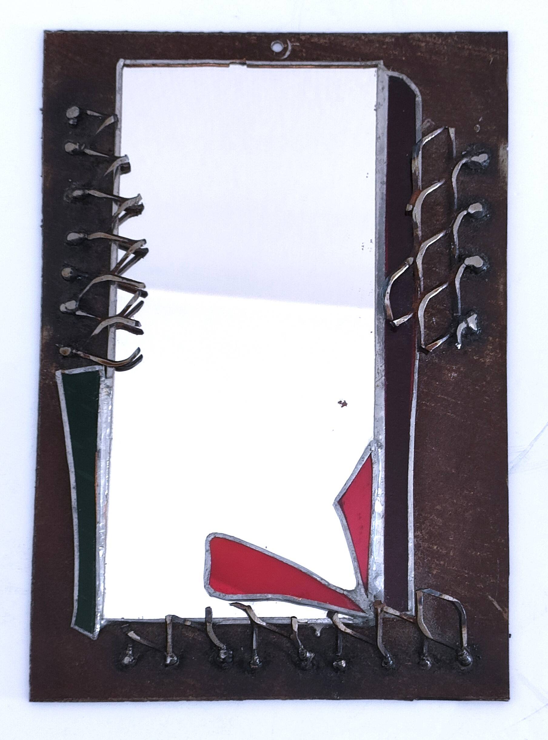 Brutalist mirror in metal and set glass