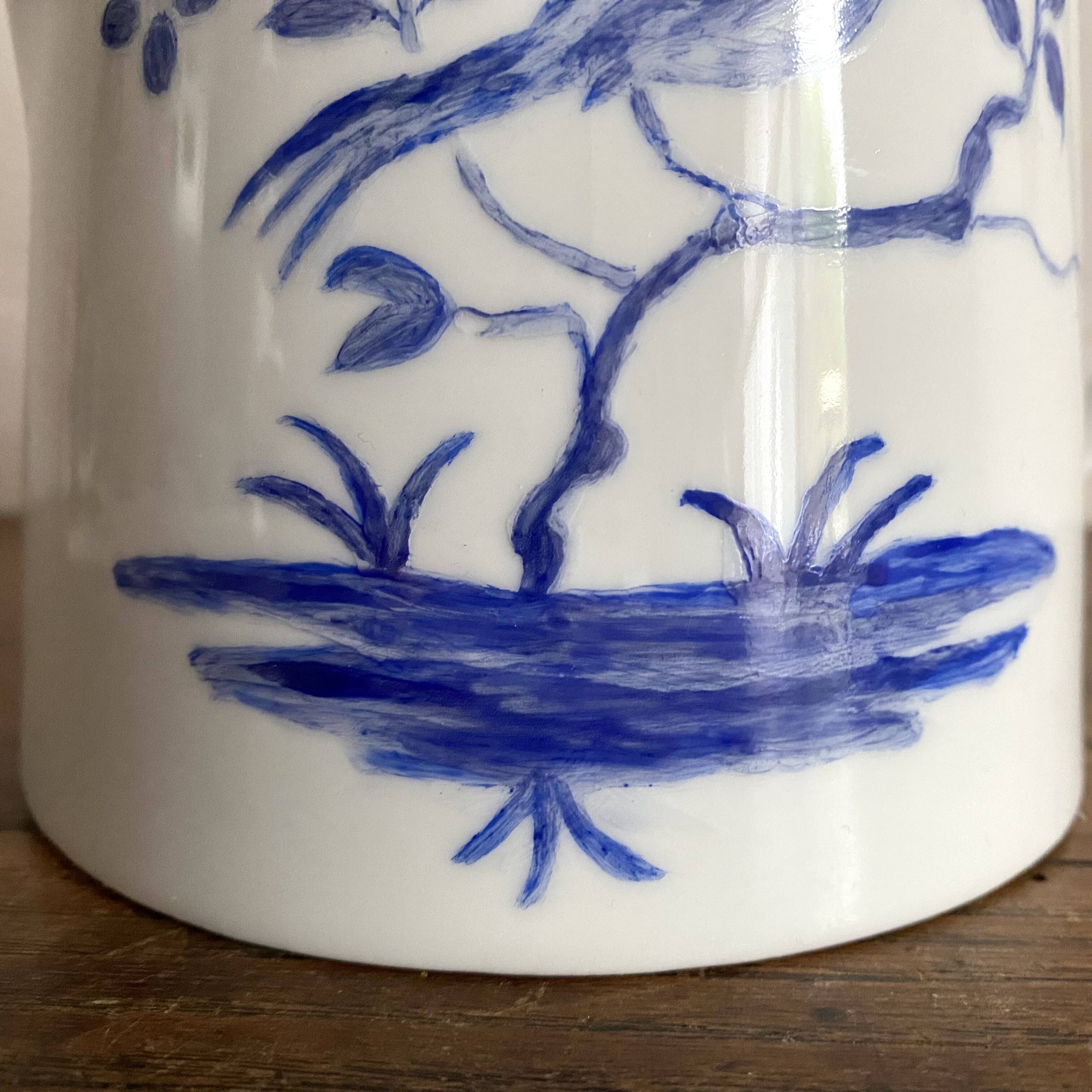 Porcelain teapot with hand-painted bird decoration