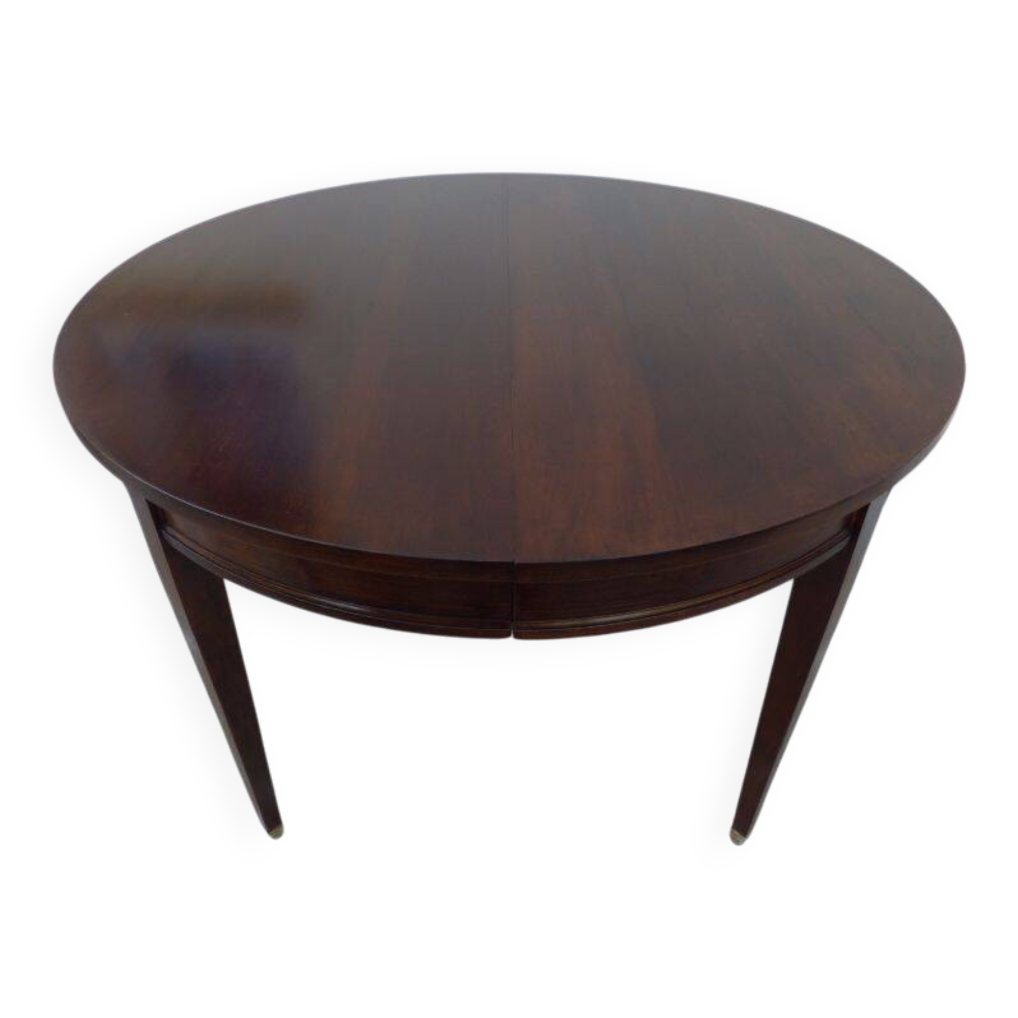 Round mahogany table with mahogany veneer and brass sabot foot.