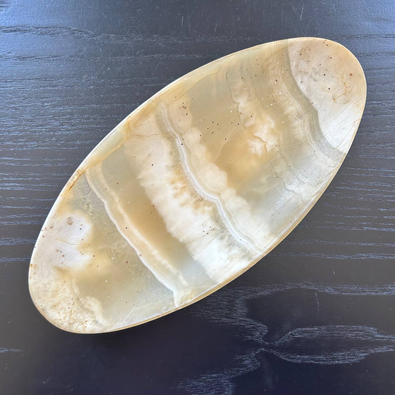 Oval onyx pocket emptier