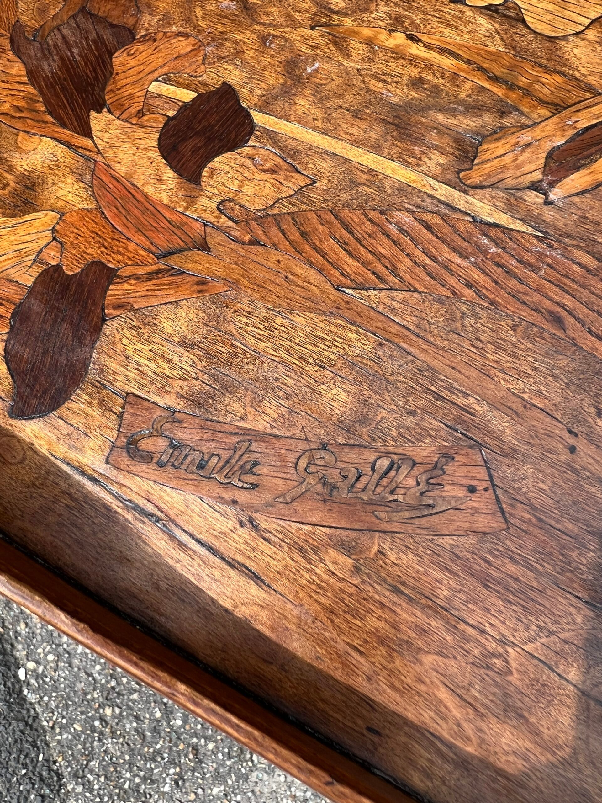 Art Nouveau period two-tiered tea table in veneered wood, signed Émile Gallé