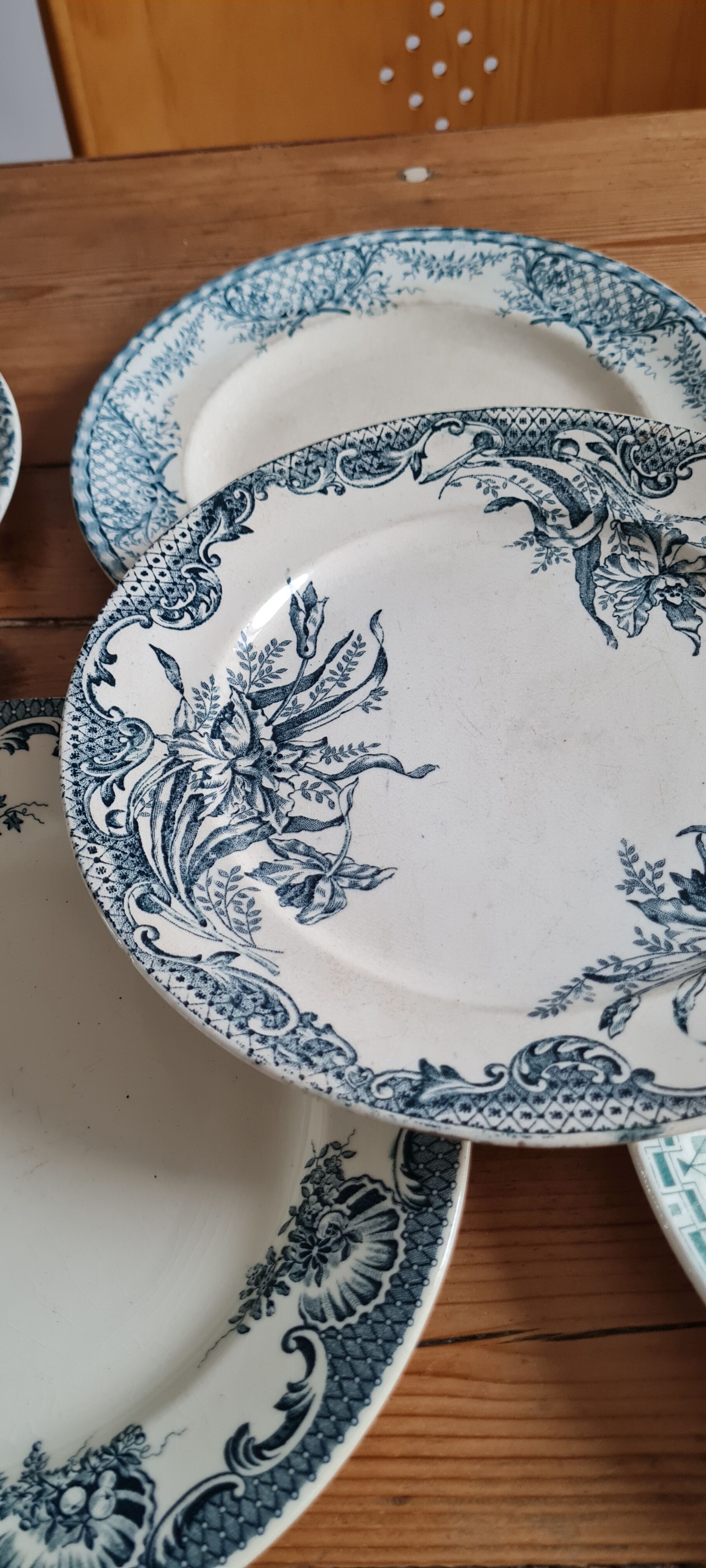 Set of 7 mismatched plates in iron earth