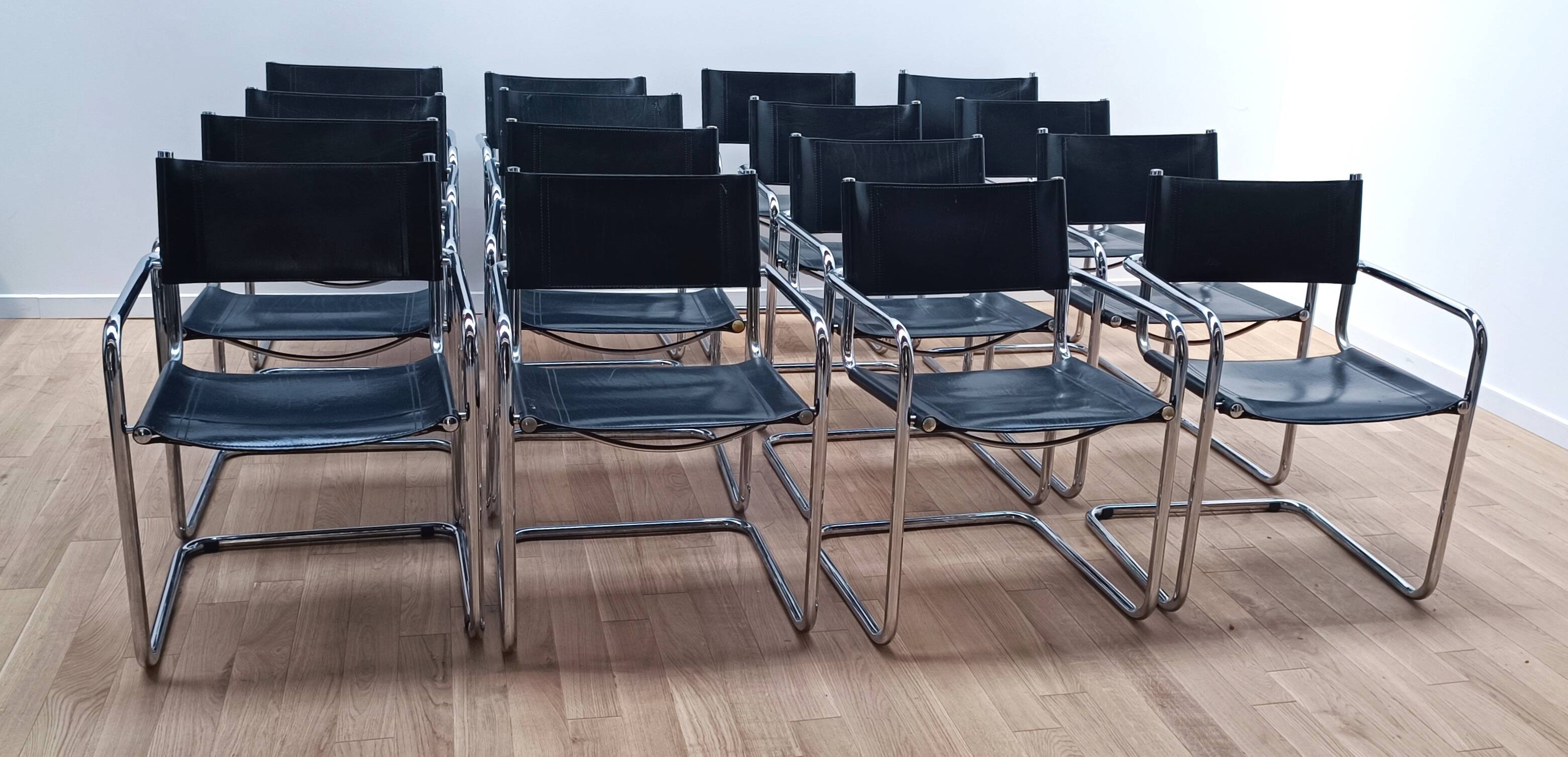 Suite of 12 designer armchairs