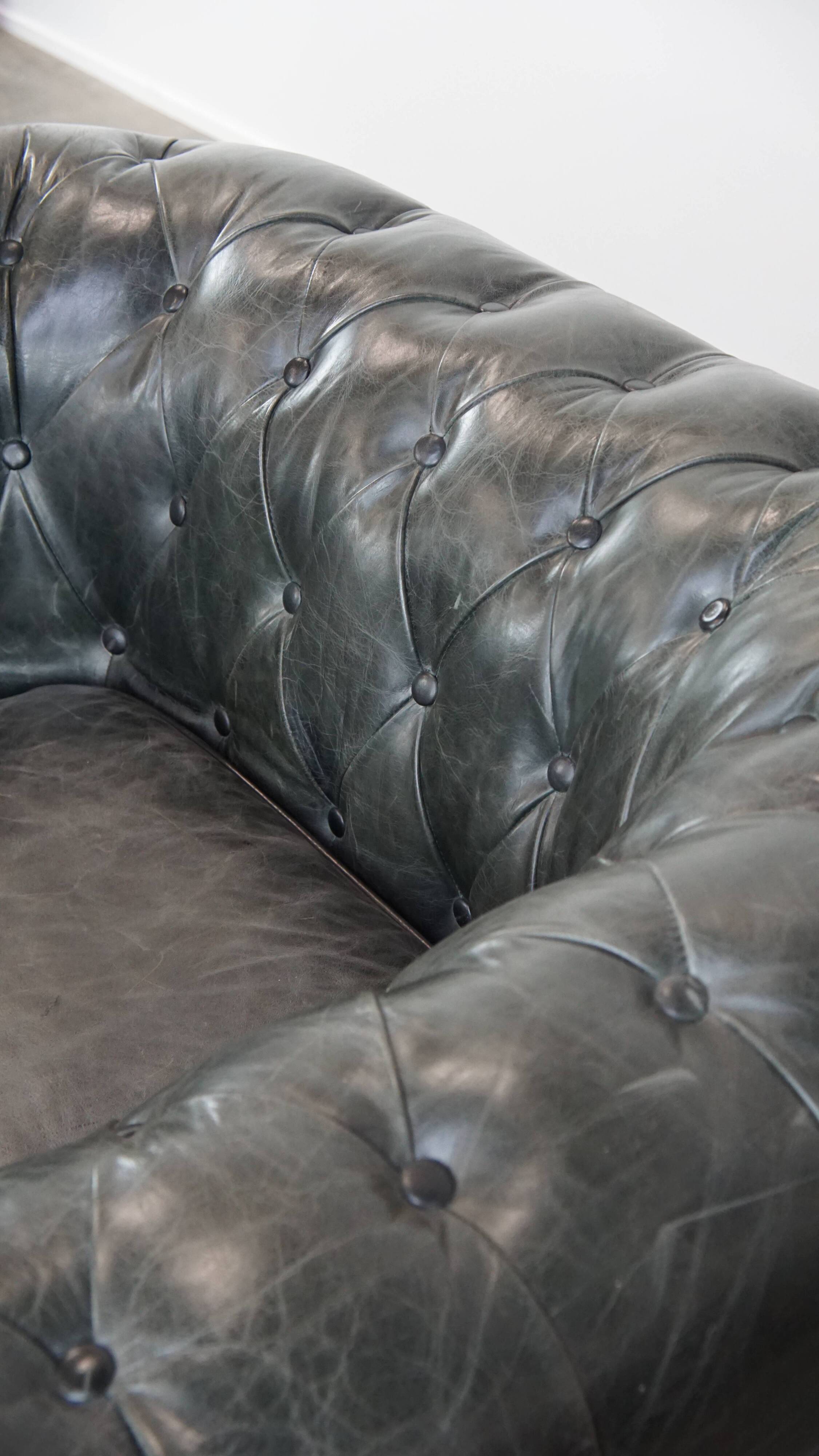Set of 2 black Chesterfield armchairs in grained cowhide leather