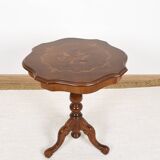 Pedestal table or side table, carved wooden legs, inlaid veneer on the top.