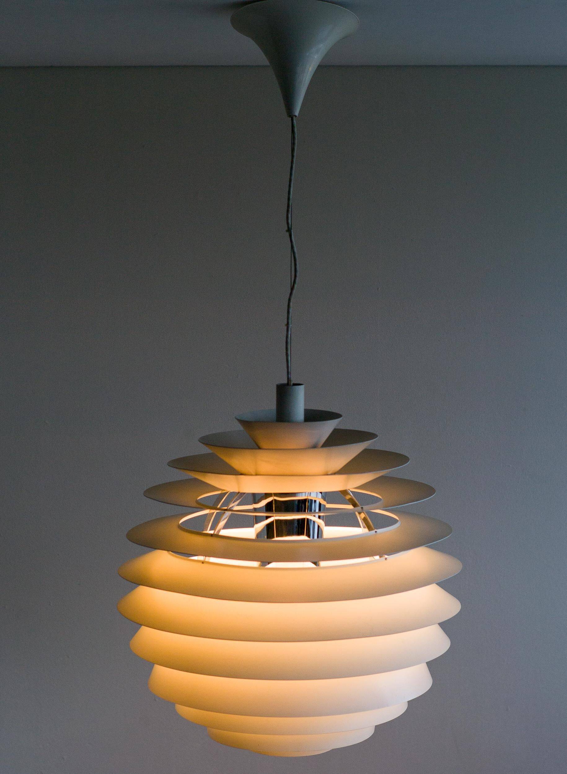 Large pendants from the early last century from the Louvre by Poul Henningsen for Louis Poulsen, 1962.