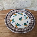 Old plate with brown border and flowers called black bottom