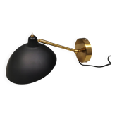 A wall lamp in black and brass-coloured finishes. Danish, early 2000s.