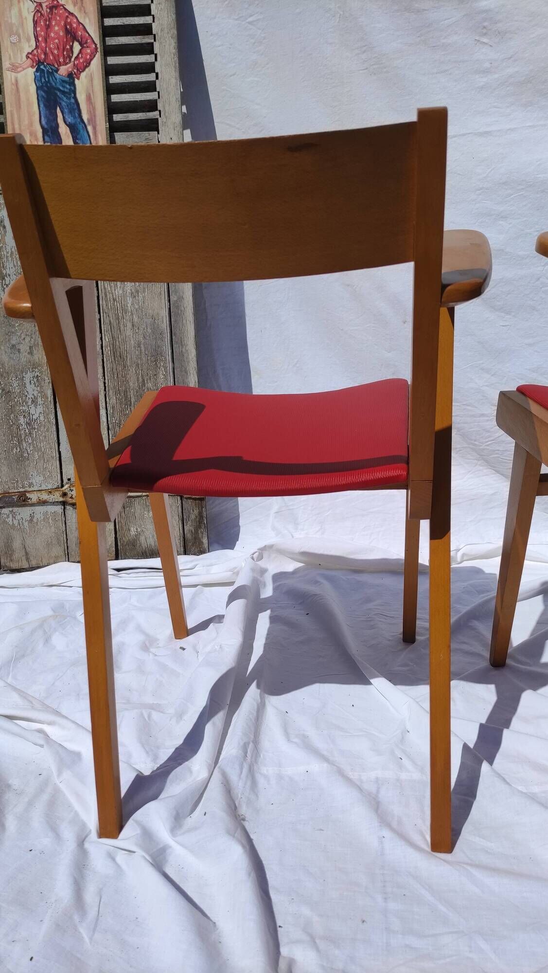 Pair of wooden armchairs and skaï foot compass of the 50s