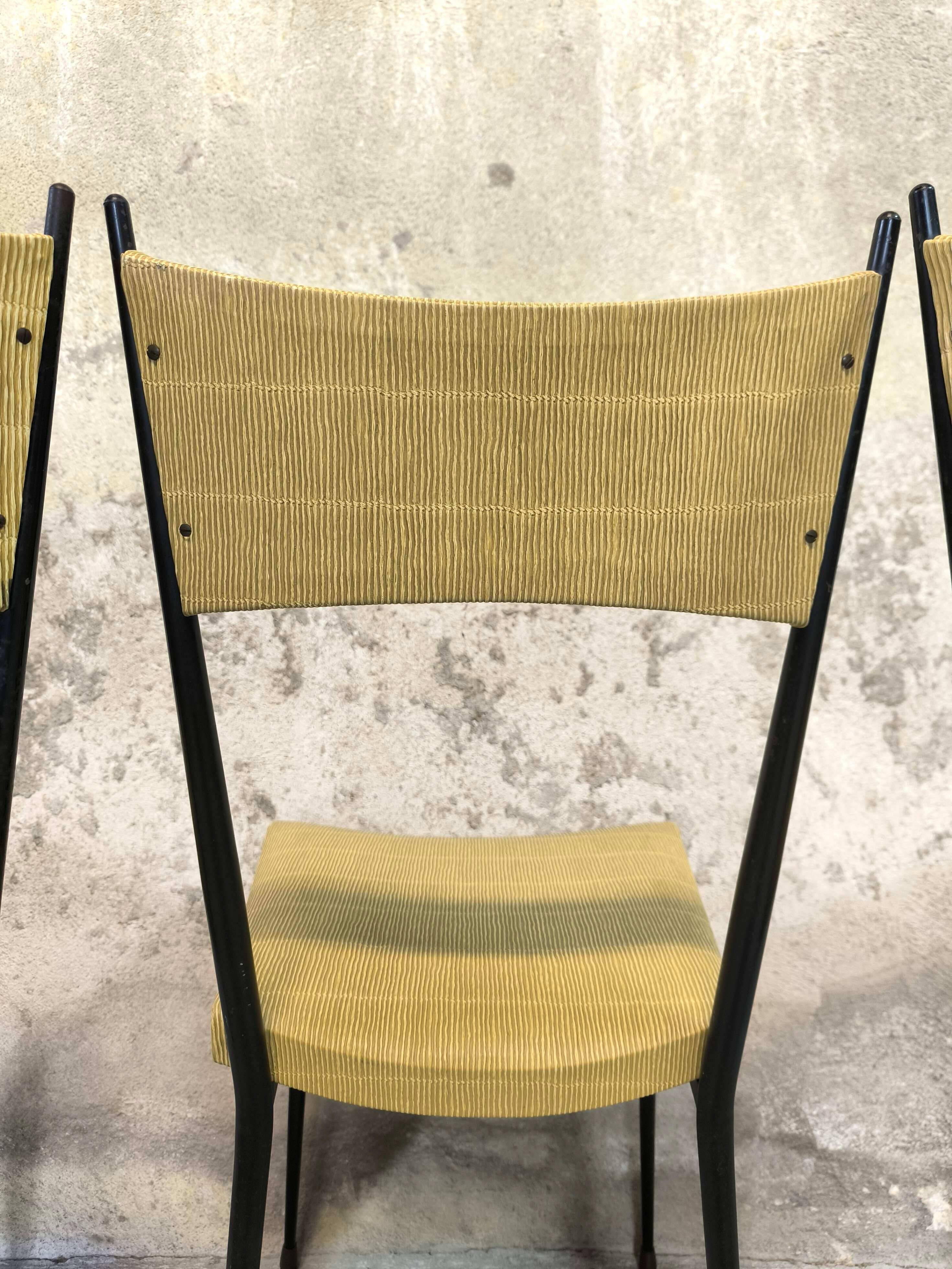 Three vintage chairs in the style of Colette Gueden.