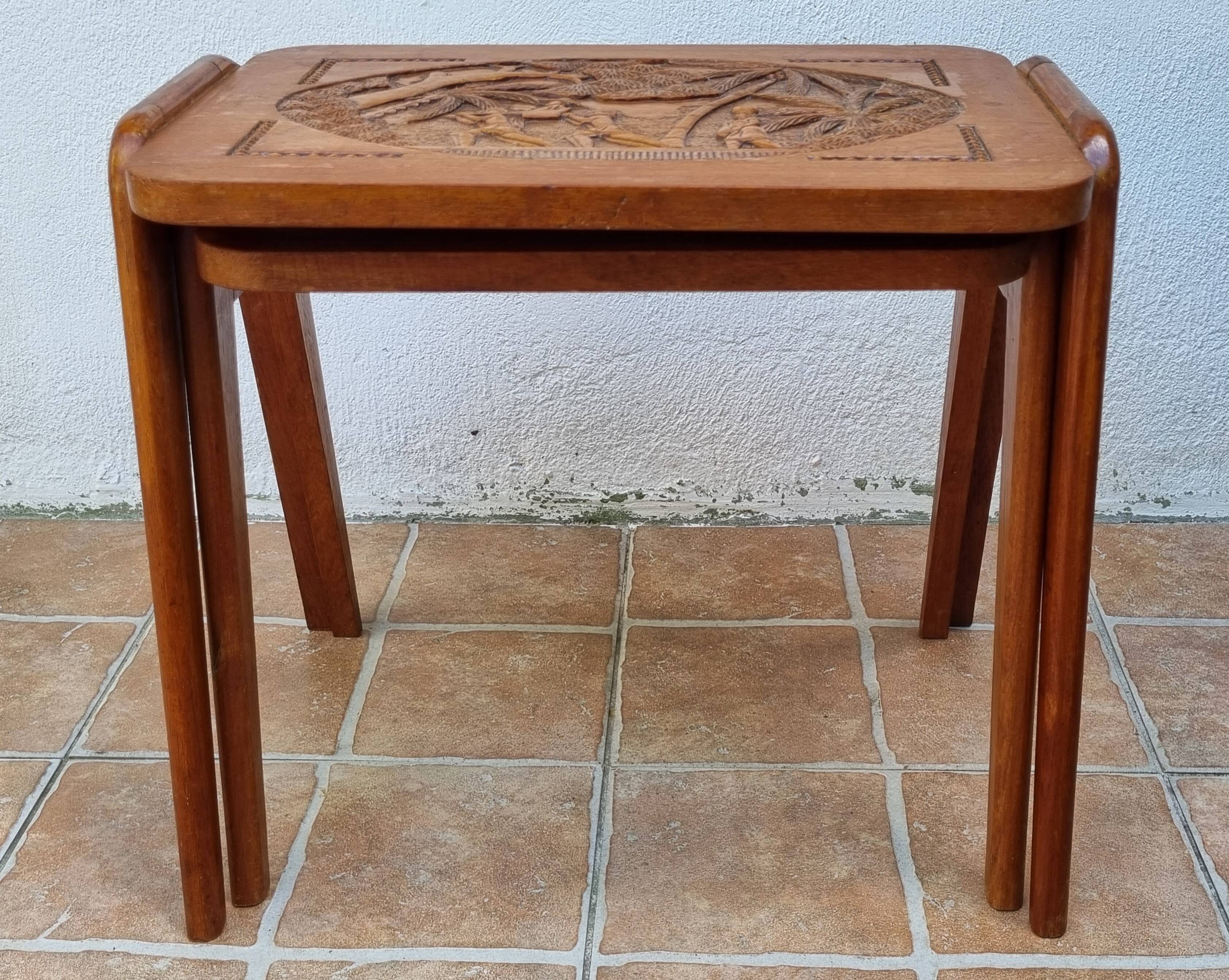 Pair of Malagasy nesting tables in carved wood, signed, m.o.f, 1955