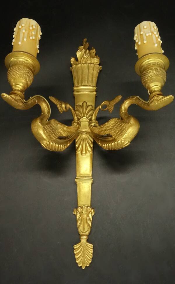 Pair of large wall sconces, torch and swans, Empire style - gilded bronze