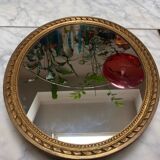 Large oval mirror in wood gilded with fine gold