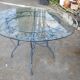 Table ronde et 4 chaises en fer forgé