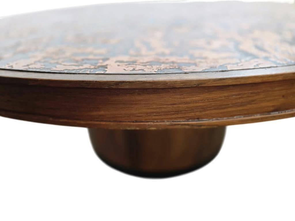 Vintage round wooden coffee table with a copper top.