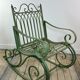 Rocking-chair en fer forgé vert patiné