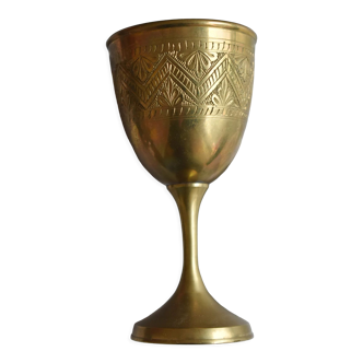 Old chalice in engraved brass
