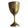 Old chalice in engraved brass