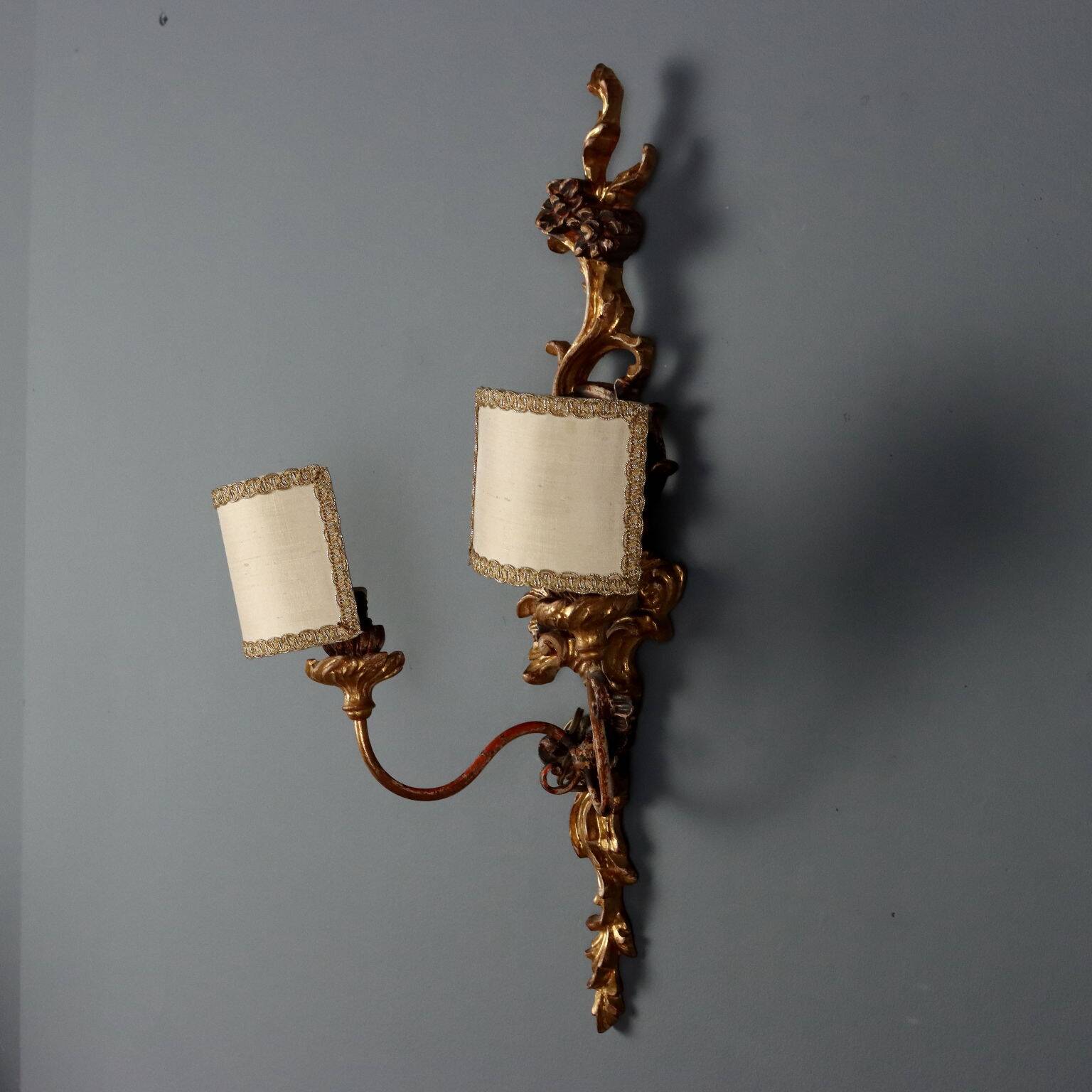 Antique wall sconces in carved lacquered and gilded wood, Italy, 20th century.