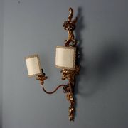 Antique wall sconces in carved lacquered and gilded wood, Italy, 20th century.