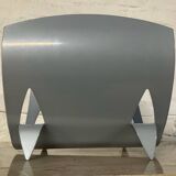 Designer log holder in enameled sheet metal
