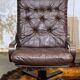 Pair of Norwegian swivel armchairs in leather and beech from the 1970s.