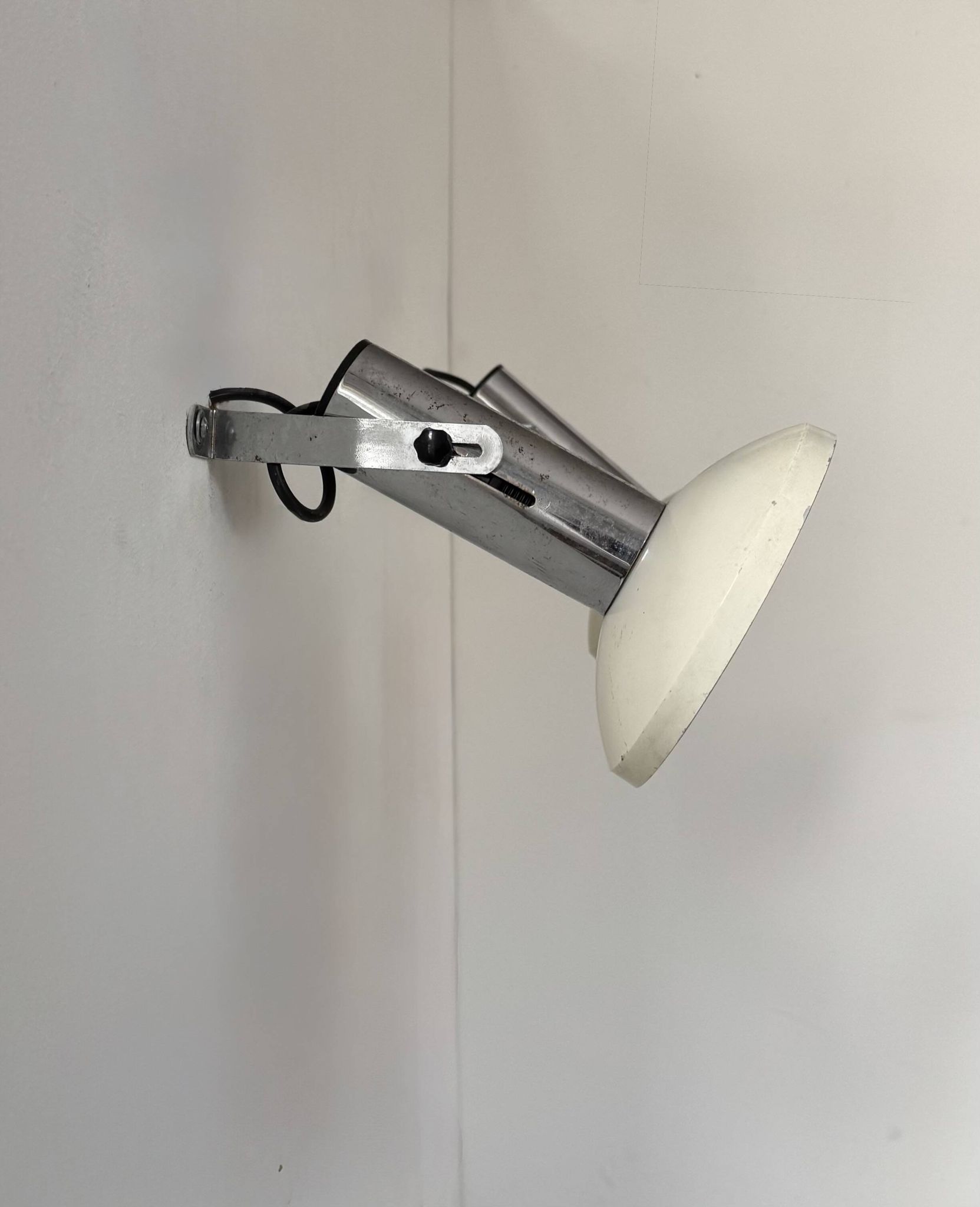 Pair of vintage adjustable wall lights, chrome and white lacquered metal, France 70