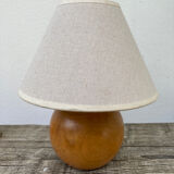 Wooden ball bedside lamp and beige lampshade