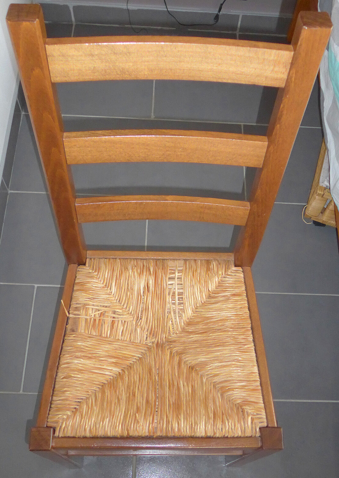 8 wooden chairs, straw seat