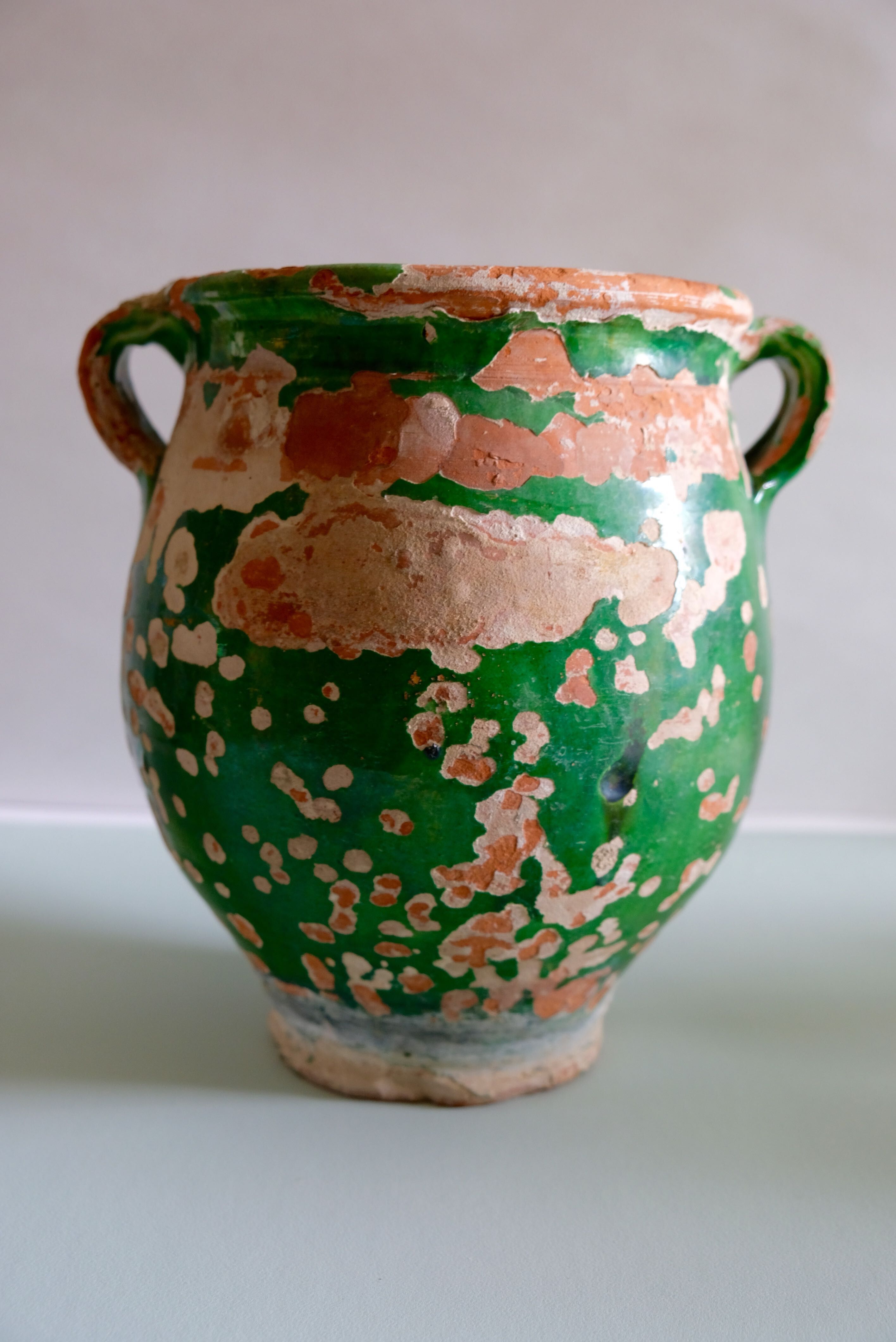 Ancient jar olive in provencal glazed terracotta, glazed green of the 19th century