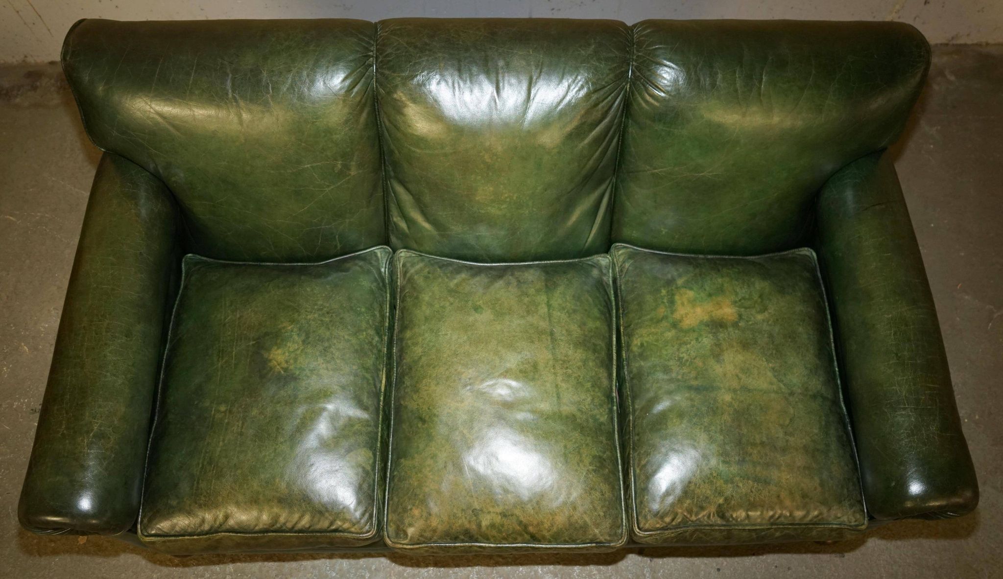 Victorian leather canapé, shield armrests, stamped Maple & Co.