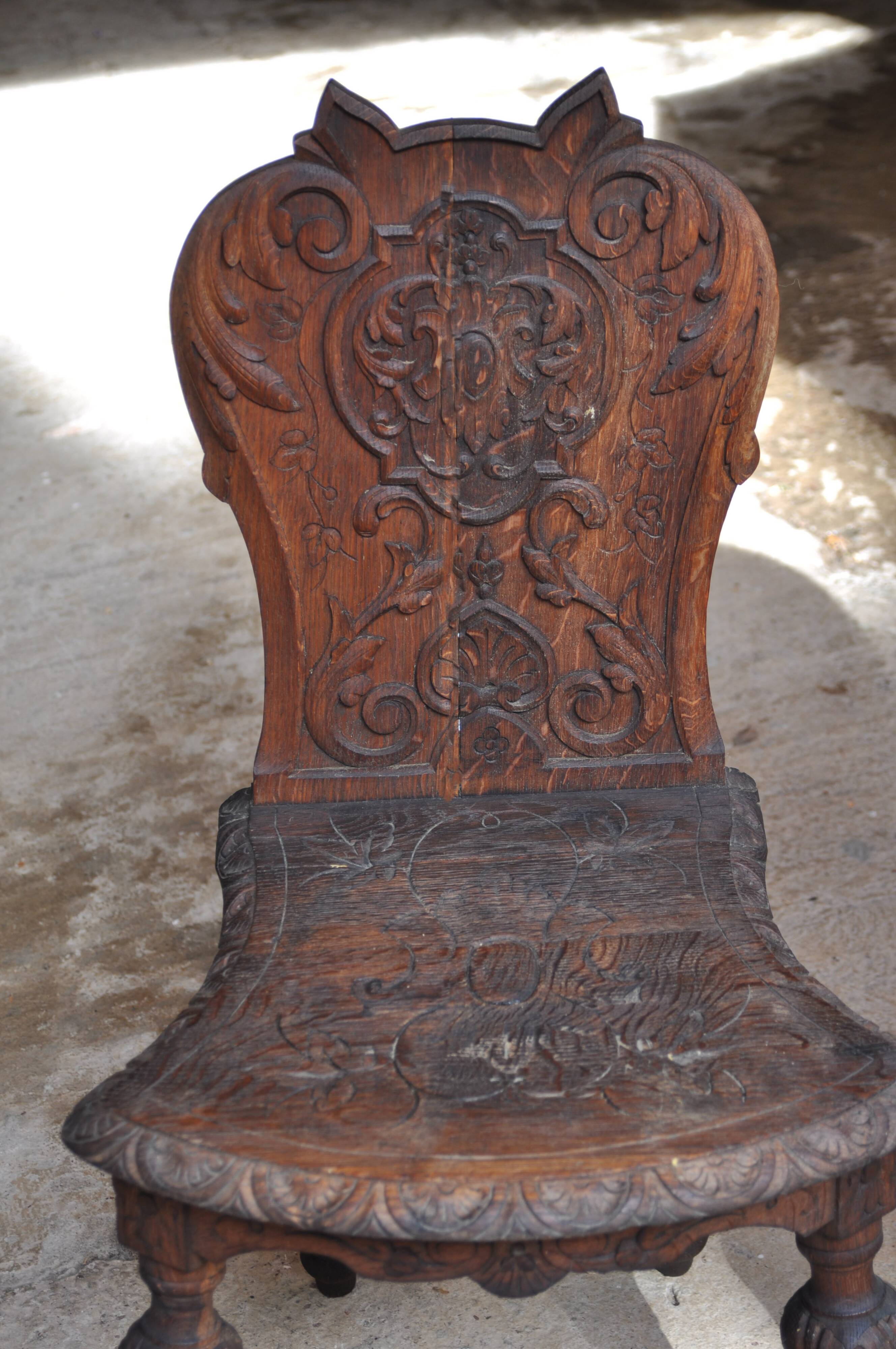 Pair of antique carved wooden chairs