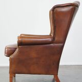Fauteuil à oreilles en cuir de vachette cognac