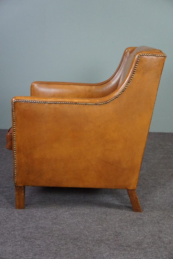 Modern charming armchair in sheepskin