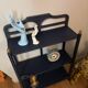Small vintage shelf reimagined in midnight blue & gold, curiosity cabinet.