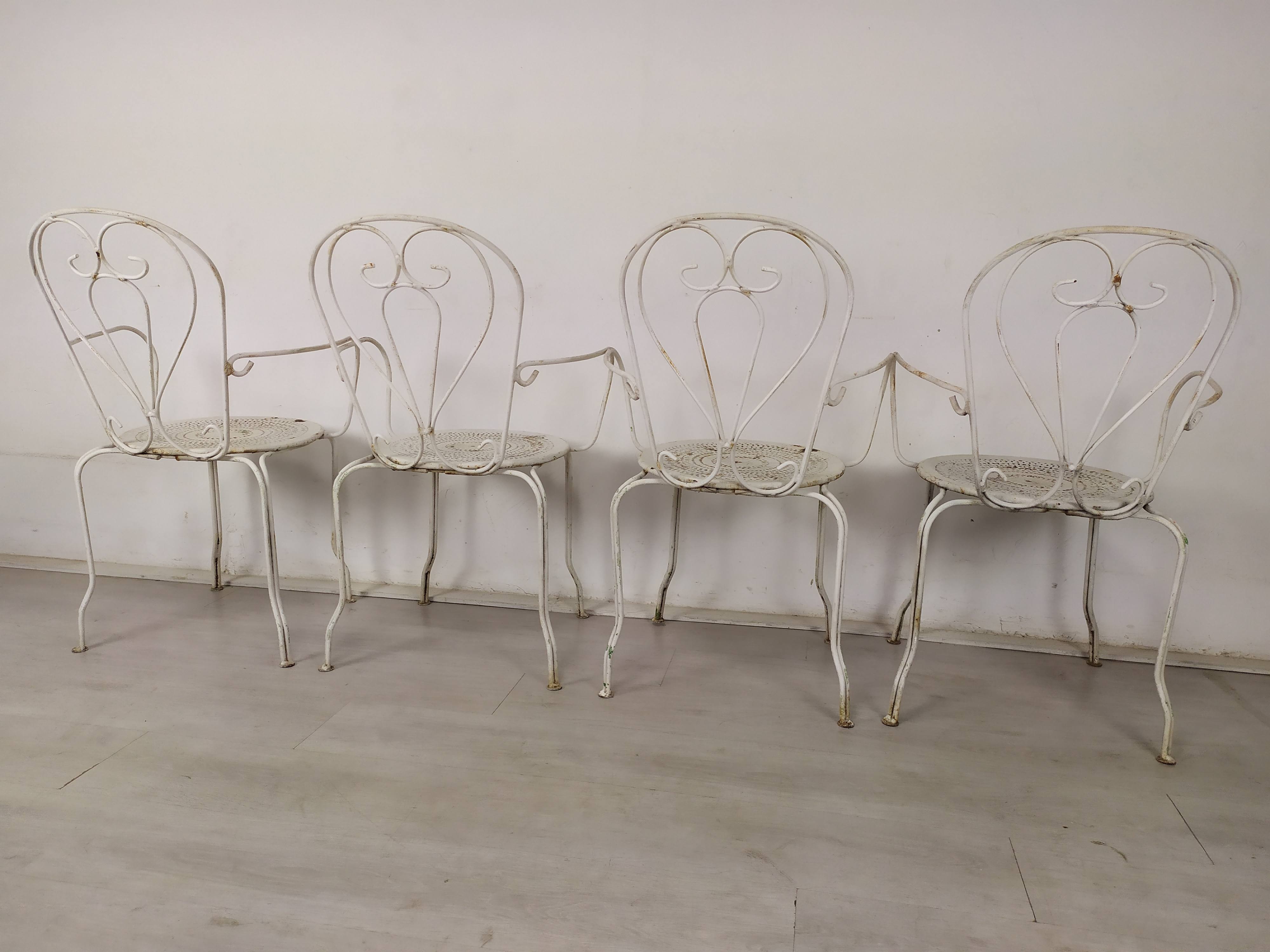 4 wrought iron garden armchairs