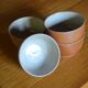 Lot of 4 bowls in sandstone and shiny grey inside