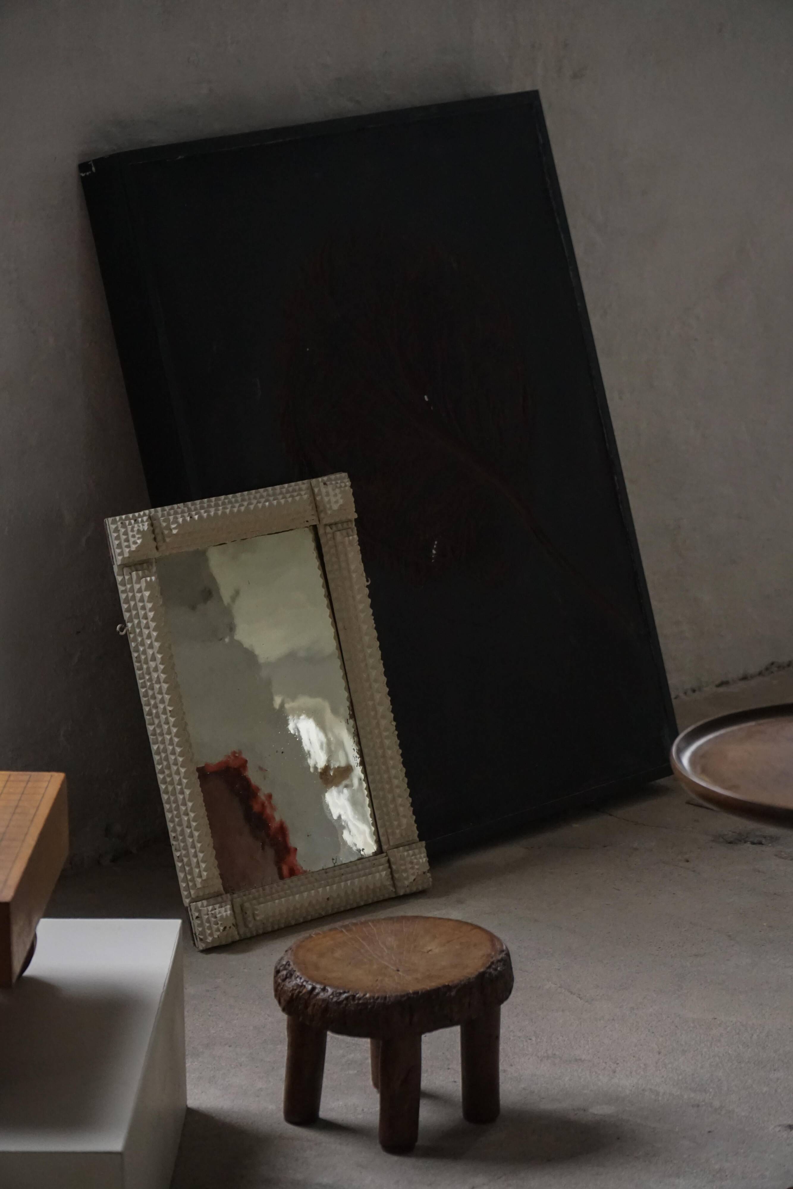 Wall mirror in tramp art style, hand-carved with a painted white frame, early 1900s.