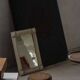 Wall mirror in tramp art style, hand-carved with a painted white frame, early 1900s.