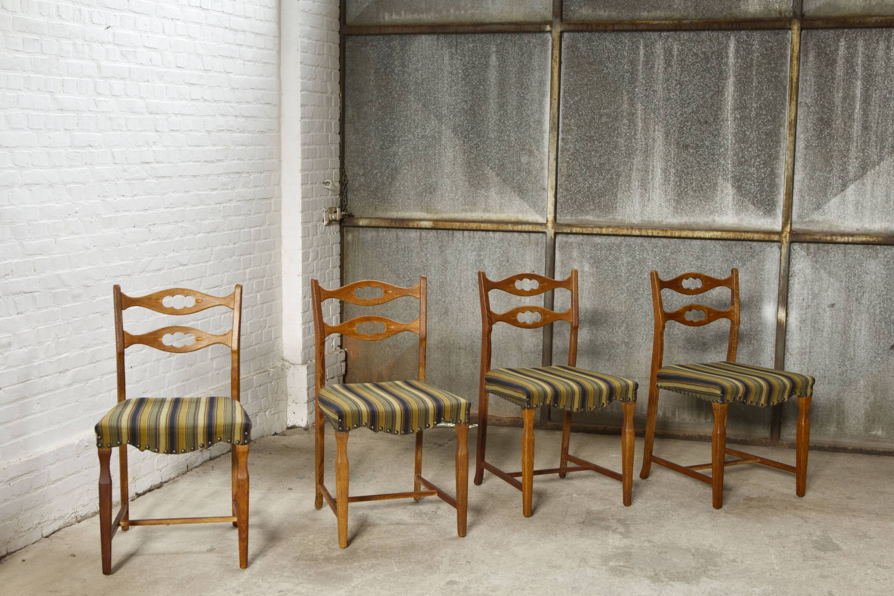 Set of four oak and wool dining room chairs by Henning Kjaernulf, 1960's