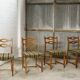 Ensemble de quatre chaises de salle à manger en chêne et laine par Henning Kjaernulf, années 1960.